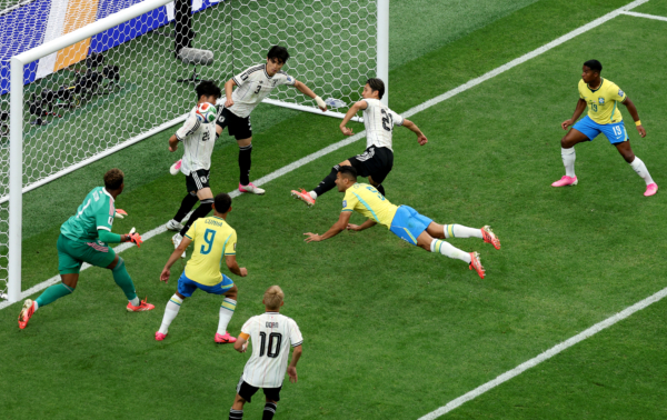 HOUSTON, TEXAS - JUNE 29: Casemiro #5 of Brazil attempts a header against Takehiro Tomiyasu #22 of Japan during the FIFA World Cup 2026 Round Of 32 match between Brazil and Japan at Houston Stadium on June 29, 2026 in Houston, Texas. 