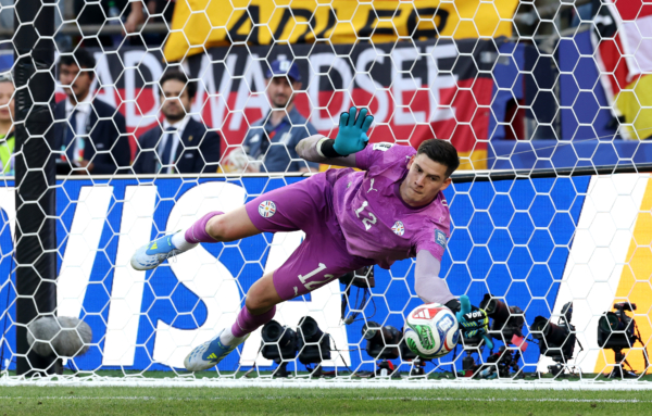 FOXBOROUGH, MASSACHUSETTS - JUNE 29: Orlando Gill #12 of Paraguay saves the Germany's fourth penalty taken by Nick Woltemade #11 of Germany during the penalty shootout during the FIFA World Cup 2026 Round Of 32 match between Germany and Paraguay at Boston Stadium on June 29, 2026 in Foxborough, Massachusetts. 