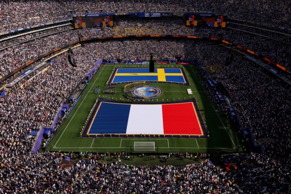 EAST RUTHERFORD, NEW JERSEY - JUNE 30: Players and match officials line up before the FIFA World Cup 2026 Round Of 32 match between France and Sweden at New York New Jersey Stadium on June 30, 2026 in East Rutherford, New Jersey.
