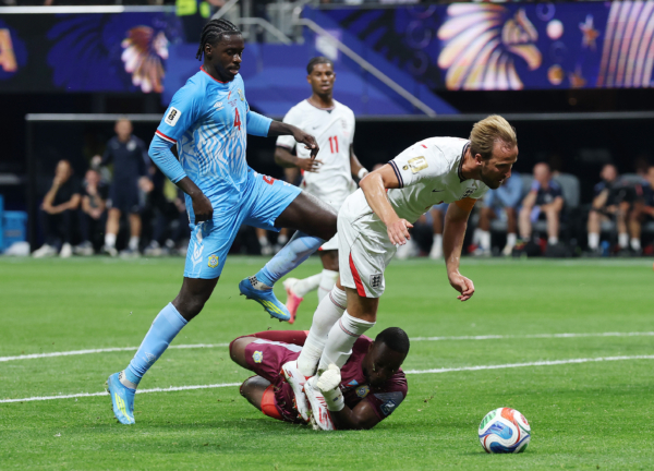 ATLANTA, GEORGIA - JULY 01: Harry Kane #9 of England is challenged by Lionel Mpasi #1 of Congo DR in the penalty box during the FIFA World Cup 2026 Round Of 32 match between England and Congo DR at Atlanta Stadium on July 01, 2026 in Atlanta, Georgia.