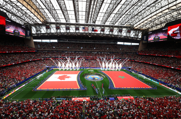 HOUSTON, TEXAS - JULY 04: Players and match officials line up before the FIFA World Cup 2026 Round of 16 match between Canada and Morocco at Houston Stadium on July 04, 2026 in Houston, Texas.