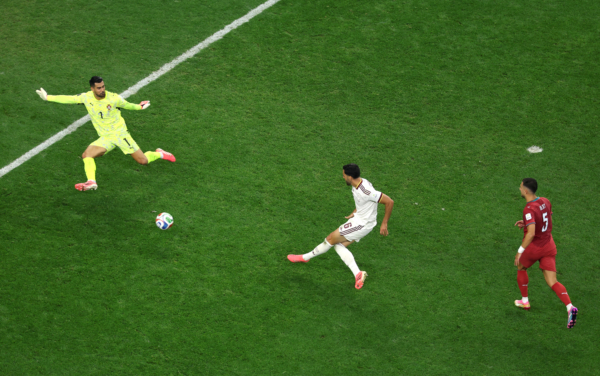 ARLINGTON, TEXAS - JULY 06: Mikel Merino #6 of Spain scores his team's first goal against Diogo Costa #1 of Portugal during the FIFA World Cup 2026 Round of 16 match between Portugal and Spain at Dallas Stadium on July 06, 2026 in Arlington, Texas.