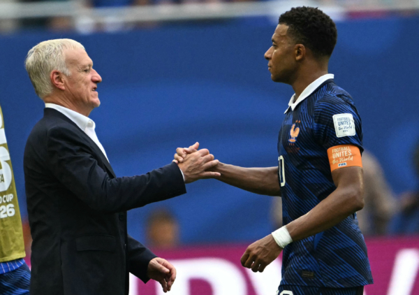 France's head coach Didier Deschamps and France's forward #10 Kylian Mbappe shake hands after losing the 2026 World Cup football tournament third-place match between France and England at the Miami Stadium in Miami on July 18, 2026.