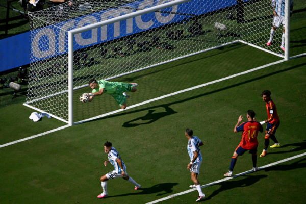 Argentina's goalkeeper #23 Emiliano Martinez makes a save during the 2026 World Cup football tournament final match between Spain and Argentina at the New York/New Jersey Stadium in East Rutherford on July 19, 2026.