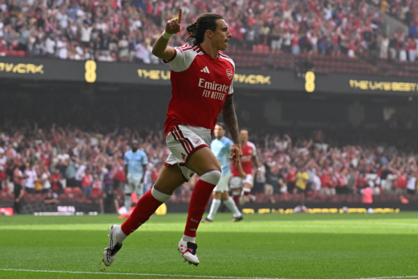 Arsenal's Italian defender #33 Riccardo Calafiori celebrates after scoring the opening goal of the English FA Community Shield football match between Arsenal and Manchester City at The Principality Stadium, in Cardiff, south Wales on August 16, 2026.