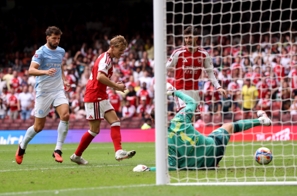 CARDIFF, WALES - AUGUST 16: Martin Odegaard of Arsenal scores his team's third goal during the 2026 FA Community Shield match between Arsenal and Manchester City at Principality Stadium on August 16, 2026 in Cardiff, Wales.