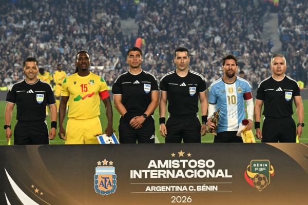 Chilean referee Fernando Vejar (C-R) poses for a photo with Argentina's forward #10 Lionel Messi and Benin's midfielder #15 Sessi D'Almeida ahead of the international friendly football match between Argentina and Benin at the Mas Monumental stadium in Buenos Aires on October 6, 2026.