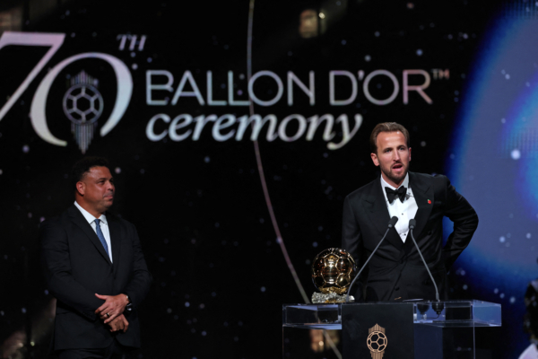 England and Bayern Munich forward Harry Kane speaks after receiving the Ballon d'Or award for the best male footballer during the 2026 Ballon d'Or France Football award ceremony at the Palladium Theatre in London on October 26, 2026. 